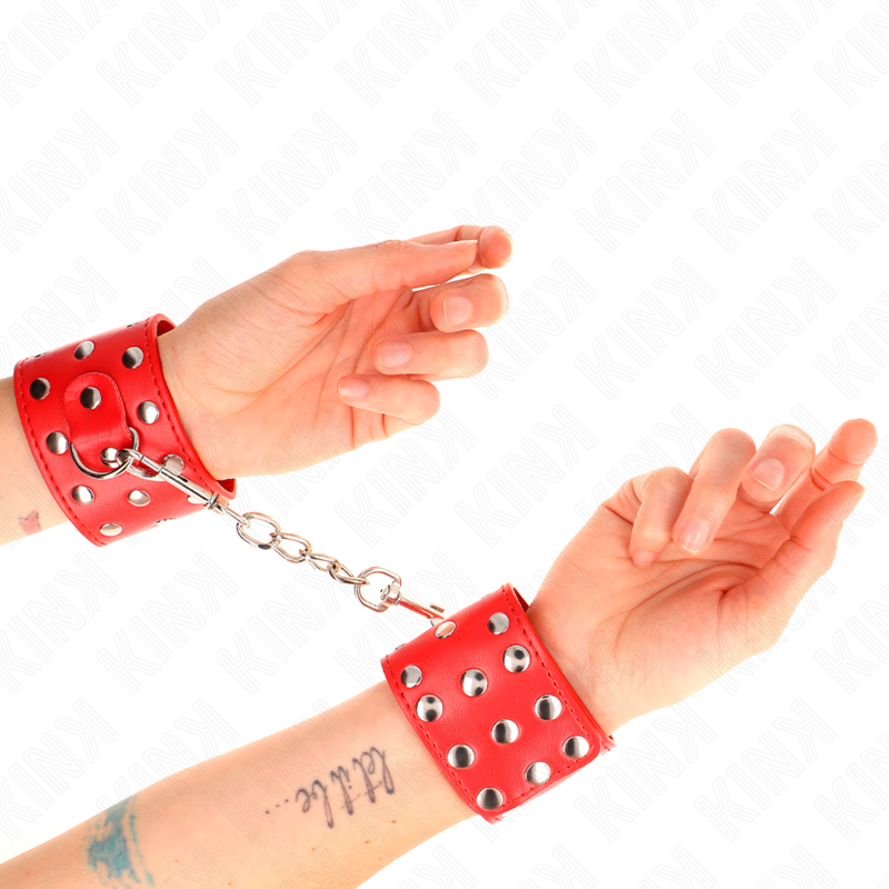 KINK - WRIST RESTRAINTS WITH SNAP FASTEN FULL OF RIVETS RED ADJUSTABLE 19-24 CM X 5.5 CM - NOCTURNA DESIRES