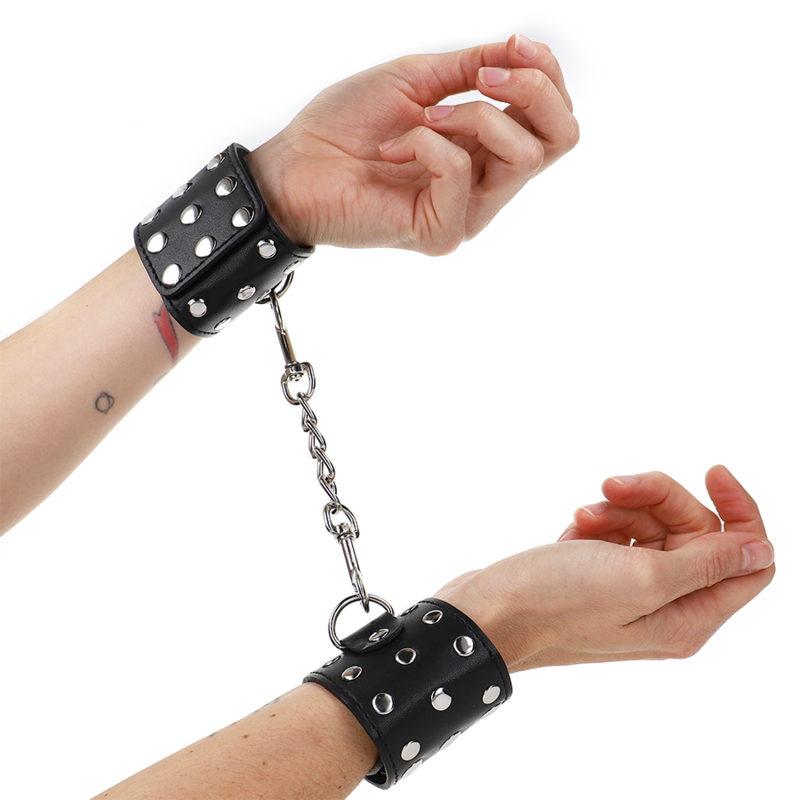 KINK - WRIST RESTRAINTS WITH SNAP FASTEN FULL OF RIVETS BLACK ADJUSTABLE 19-24 CM X 5.5 CM - NOCTURNA DESIRES