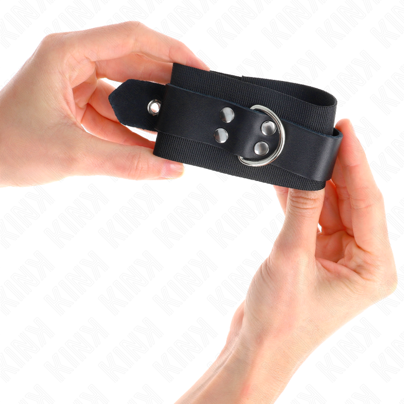 KINK - NYLON WRIST RESTRAINTS BLACK WITH LEATHER BELT BLACK ADJUSTABLE 19-29 CM X 5.1 CM - NOCTURNA DESIRES