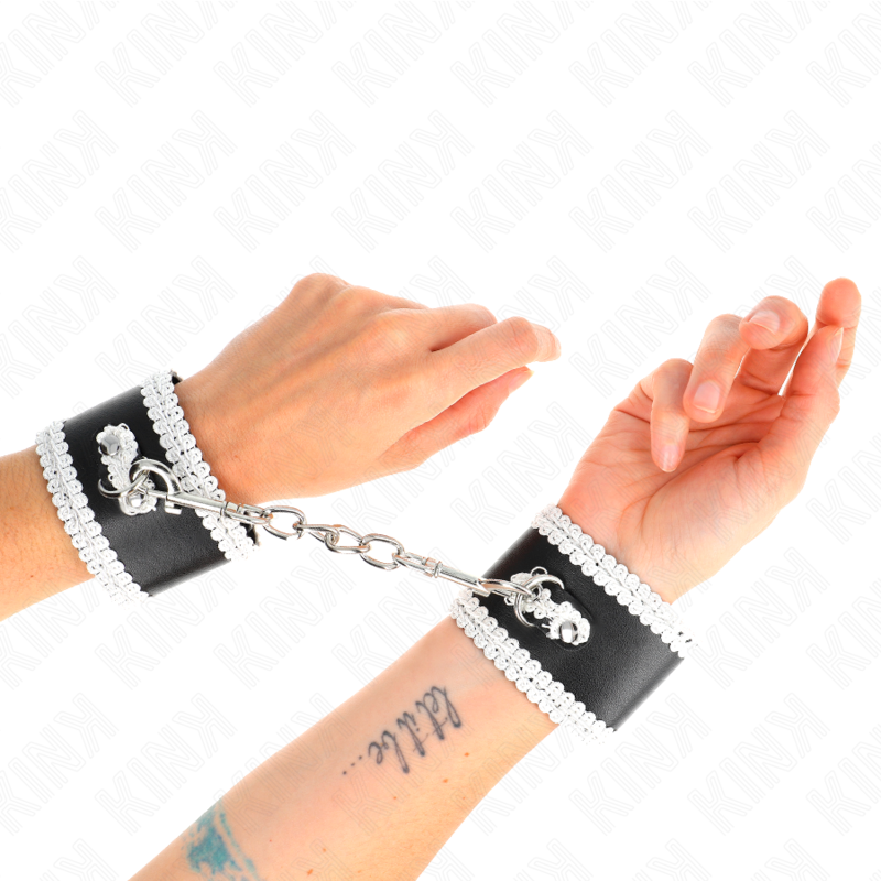 KINK - BLACK WRIST RESTRAINTS WITH WHITE DECORATE LACE ADJSUTABLE 20-23 CM X 5.5 CM - NOCTURNA DESIRES